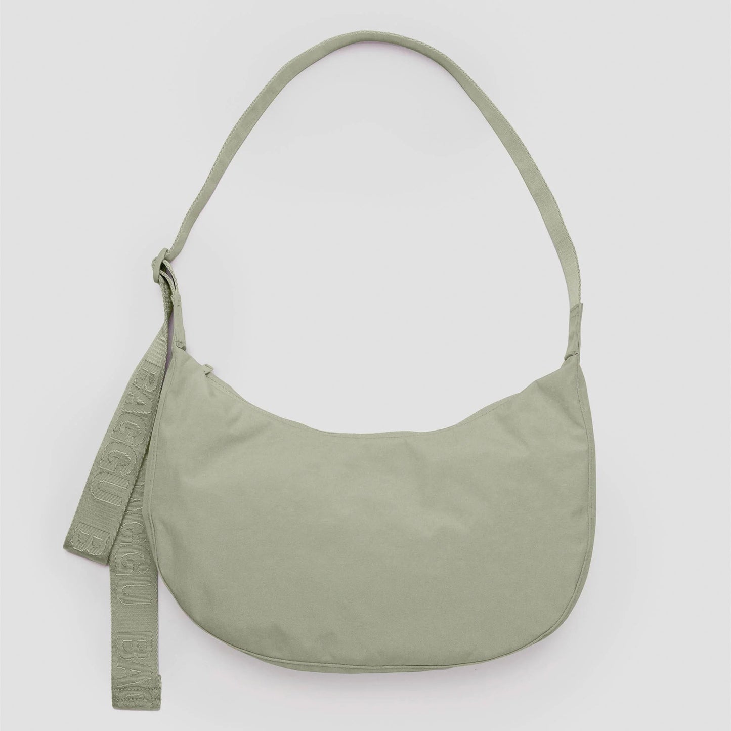 Green shoulder bag on a light gray background