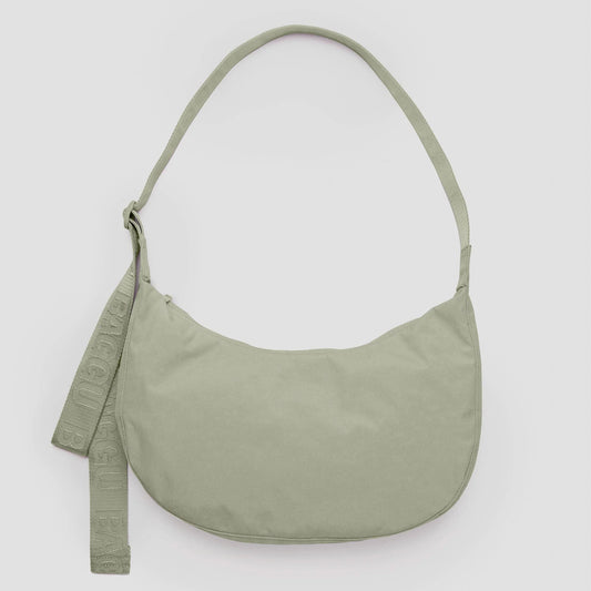 Green shoulder bag on a light gray background