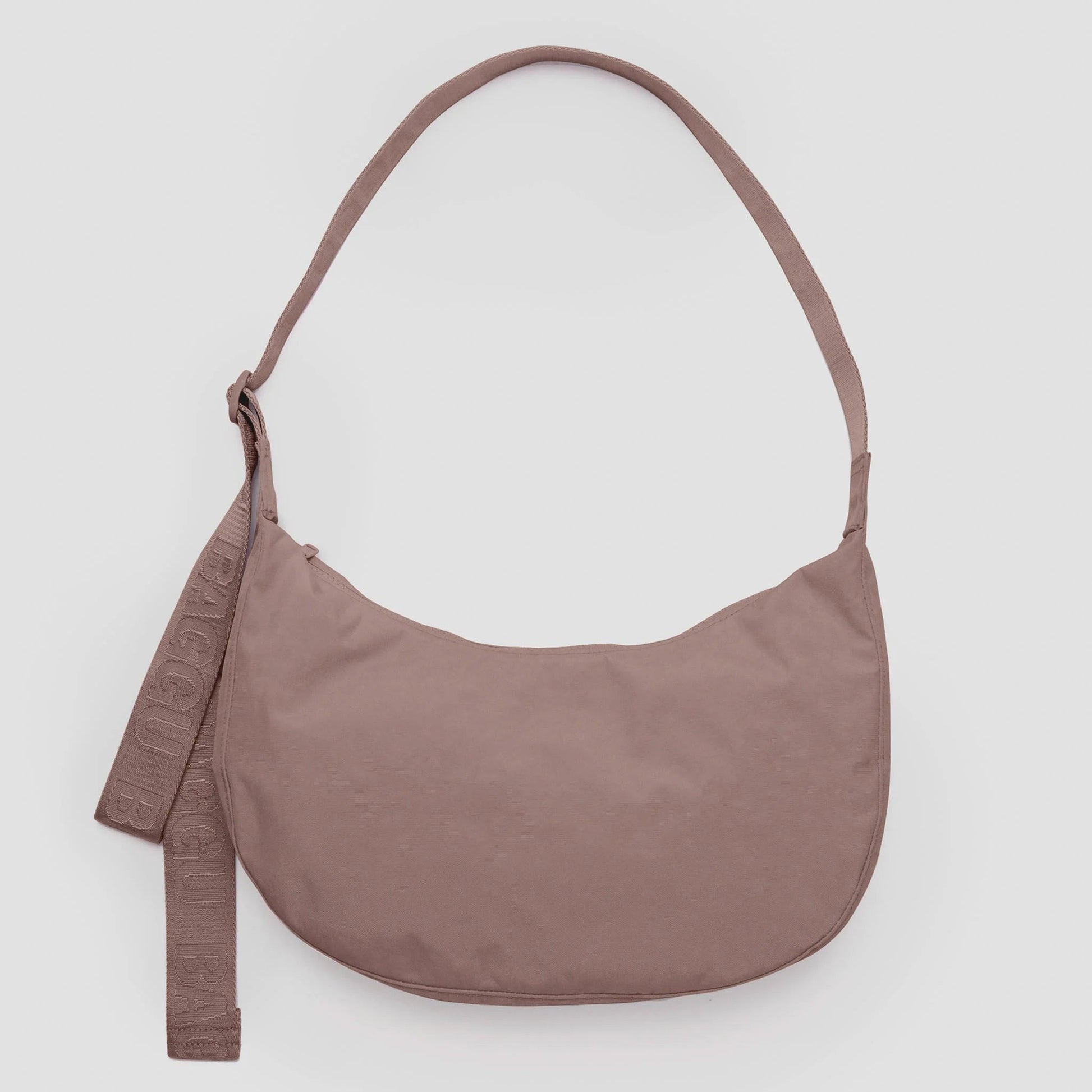 Tan shoulder bag on a light gray background