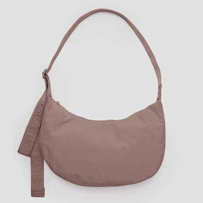 Tan shoulder bag on a light gray background