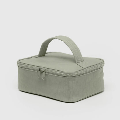 Green rectangular cosmetic case with a handle on a light gray background