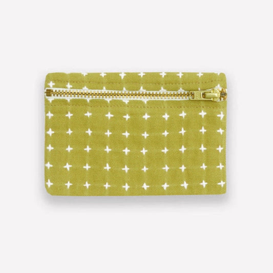 Green coin purse with white cross stitch pattern on a white background